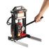 User operating the handle of the Dabpress Amberiflow 6-Ton rosin press with visible pressure gauge and hydraulic jack